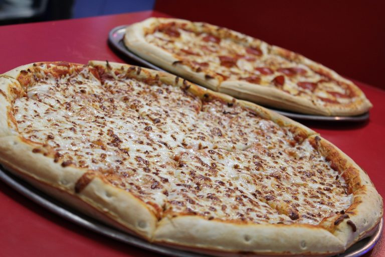 Classic pepperoni pizza fresh out of the oven at Fun Zone, perfect for skaters and families to enjoy.