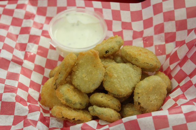 Golden, crispy fried pickles from Fun Zone Café, a perfect combination of crunchy and flavorful.