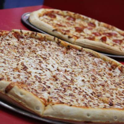 Classic pepperoni pizza fresh out of the oven at Fun Zone, perfect for skaters and families to enjoy.